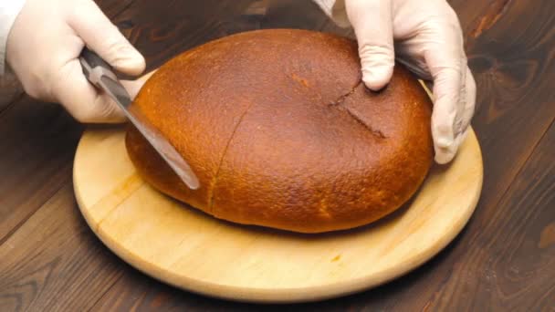 Slicing Bread Hands White Gloves Cut Loaf Brown Bread Large — Stock video