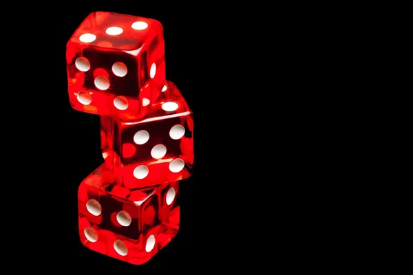 Three red dice on black background — Stock Photo, Image