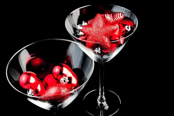 Red christmas decoration in the champagne glass — Stock Photo, Image