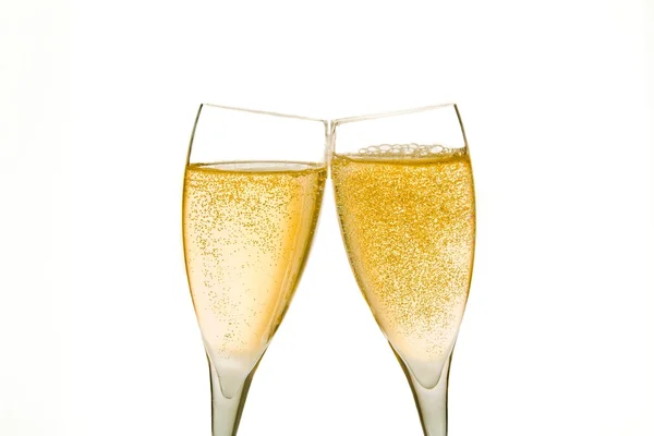 Cheers, two champagne glasses with gold bubbles — Stock Photo, Image