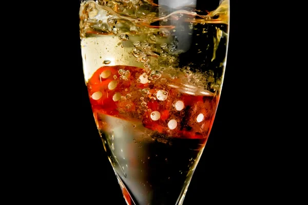 Detail of the red dice dropping in the champagne flute — Stock Photo, Image