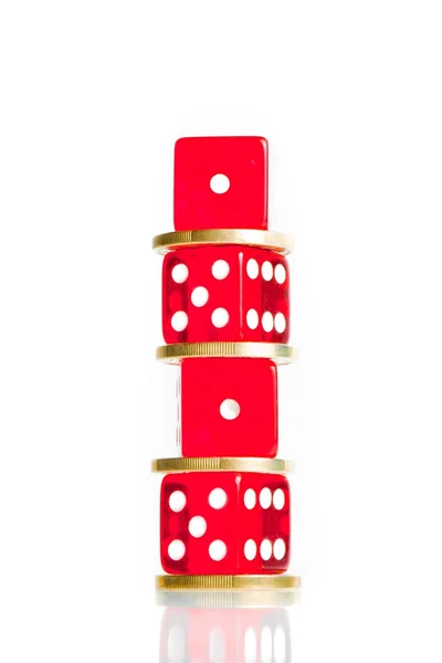 Spread, the euro coins and dice red stacked — Stock Photo, Image