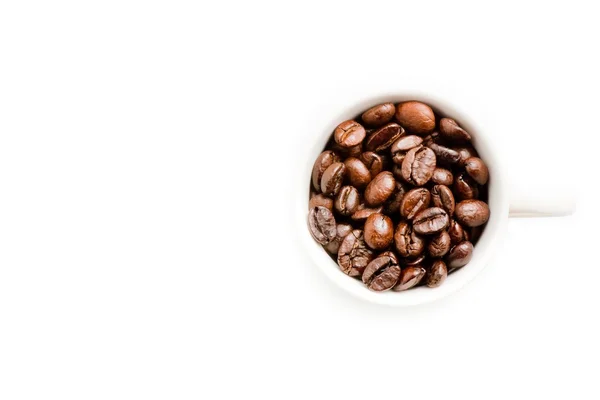 Vista dall'alto di una tazza di chicchi di caffè con spazio per il testo — Foto Stock