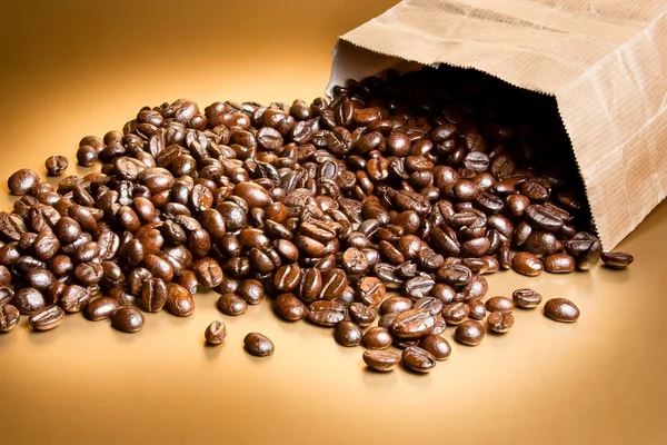 Coffee beans in a paper bag — Stock Photo, Image