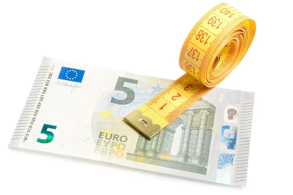 Roll of measuring tape on new five euro banknote — Stock Photo, Image