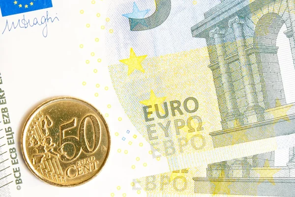 Euromunt op nieuwe vijf euro biljet — Stockfoto