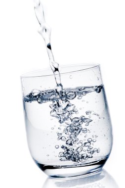 filling a glass with pure water