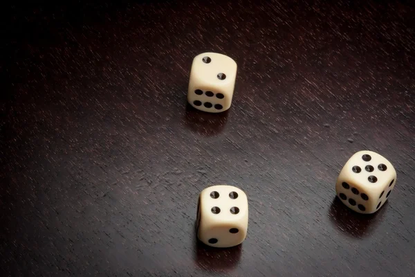 Dice on old wood table — Stock Photo, Image