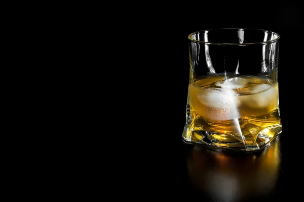 Glass of whiskey with ice with space for text — Stock Photo, Image