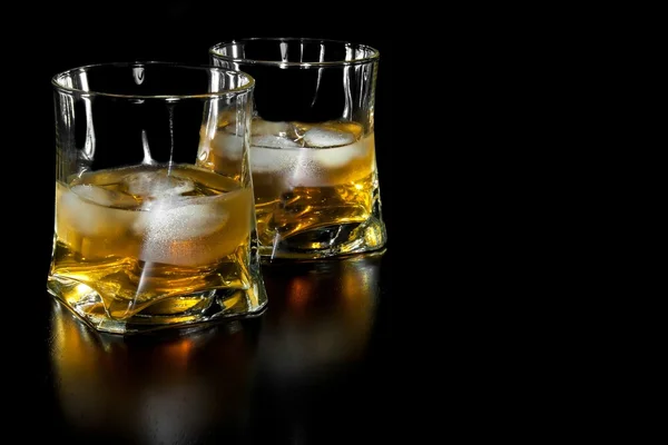 Two glasses of whiskey with ice with space for text — Stock Photo, Image
