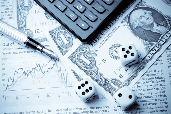 Dice on financial chart near dollars and calculator — Stock Photo, Image