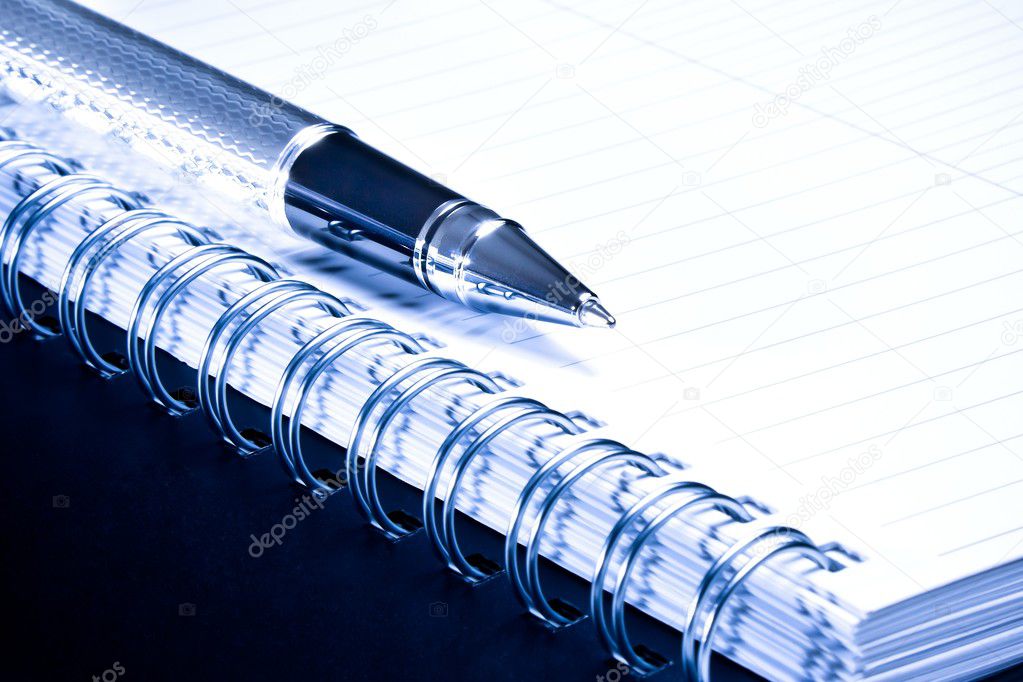 notebook and business pen in composition