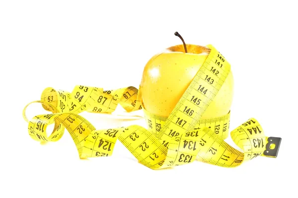 Measuring tape around yellow apple, diet concept — Stock Photo, Image