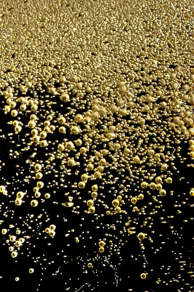 Golden bubbles of champagne texture — Stock Photo, Image