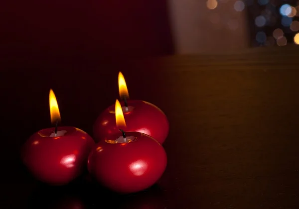 Top of view of red christmas candles on warm tint light and bokeh background — Stock Photo, Image