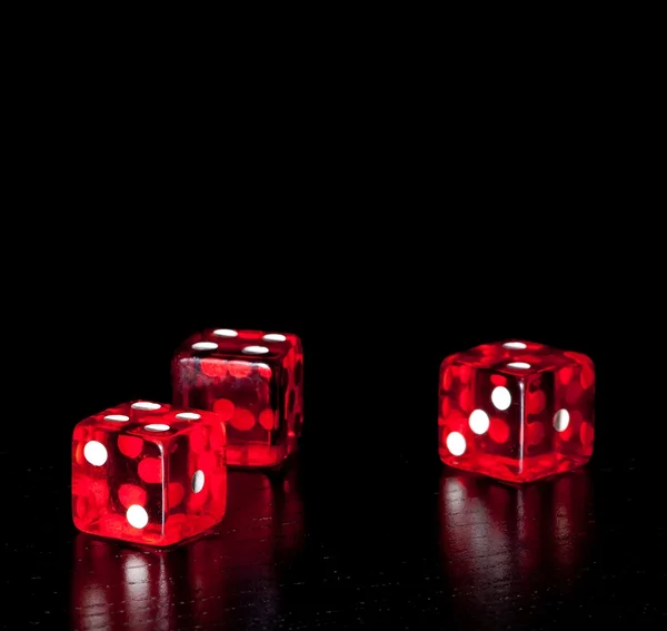 Three red dice on old wood black table with space for text — Stock Photo, Image