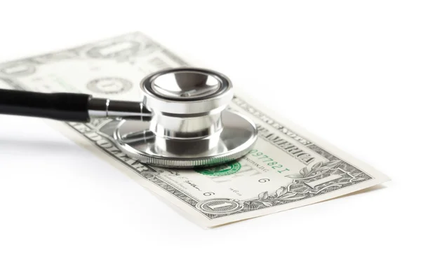 Estetoscopio con un dólar, costo de atención médica — Stockfoto