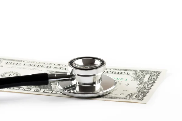 Stethoscope on one dollar, cost of medical health care — Stock Photo, Image