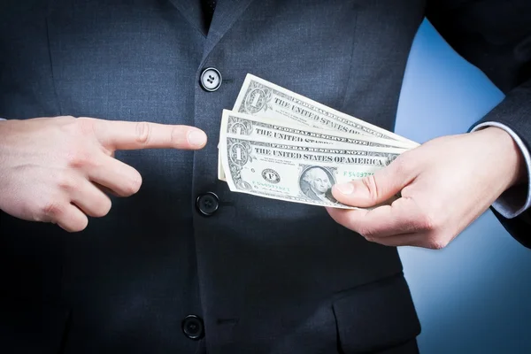 Affärsman med dollar i hans hand, koncept för företag och tjäna pengar — Stockfoto