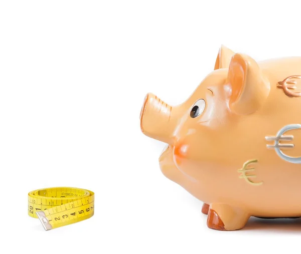 Detail von Sparschwein und Maßband, Konzept für Unternehmen und Geld sparen — Stockfoto