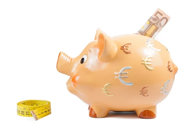 Detail of piggy bank, measure tape and fifty euro banknote, concept for business and save money — Stock Photo, Image