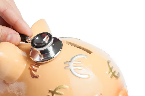 Stethoscope on a piggy bank, concept for save money — Stock Photo, Image