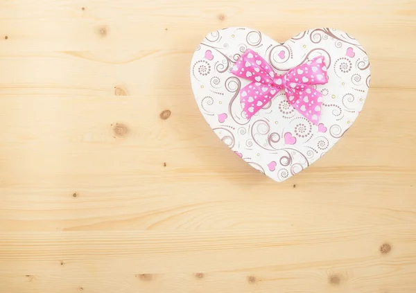 Valentine day gift with ribbon on wood table — Stock Photo, Image