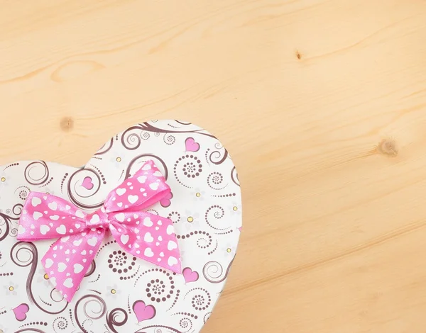 Gift box with ribbon on wood table, concept of valentine day — Stock Photo, Image