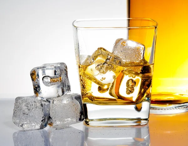 Glass of whisky with ice — Stock Photo, Image