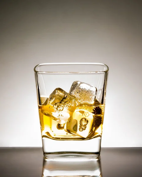 Glass of whisky with ice — Stock Photo, Image