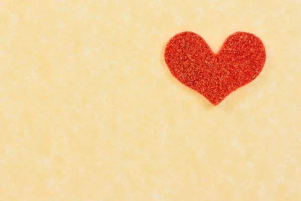 Red heart on vintage parchment paper background — Stock Photo, Image