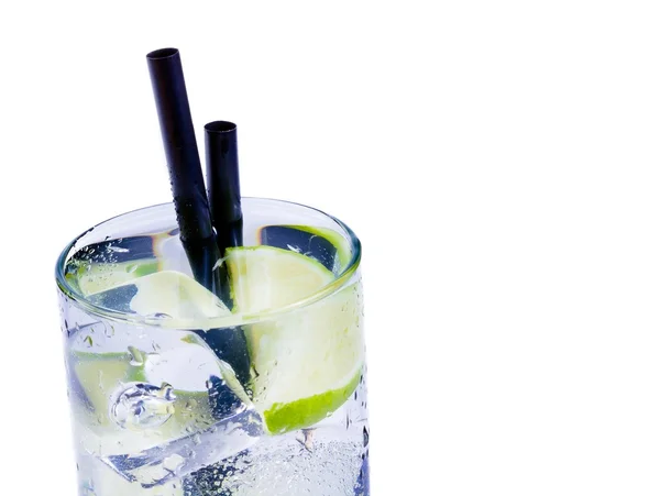 Cocktail with ice and lime slice isolated and space for text — Stock Photo, Image