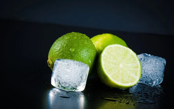 Lime with ice cubes with space for text — Stock Photo, Image