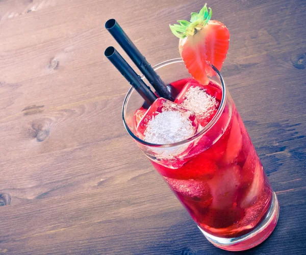 Strawberry cocktail with ice on old wood table, old style — Stock Photo, Image