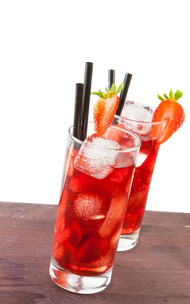 Two glasses of strawberry cocktail with ice on white background — Stock Photo, Image