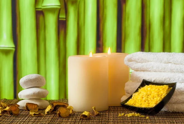 Spa massage border background with towel stacked, candles and sea salt — Stock Photo, Image