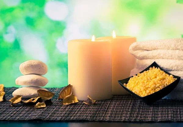 Spa massage border background with towel stacked, candles and sea salt — Stock Photo, Image