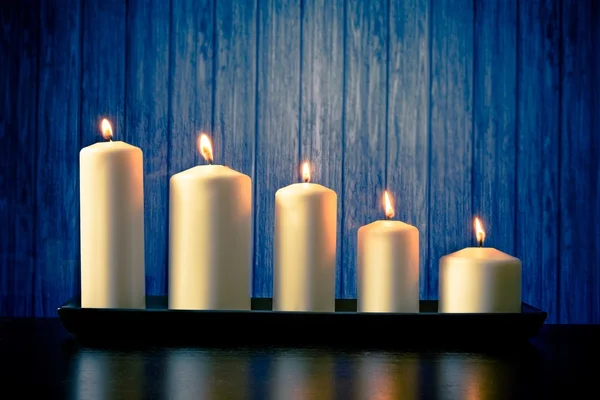 White candles on wood table — Stock Photo, Image