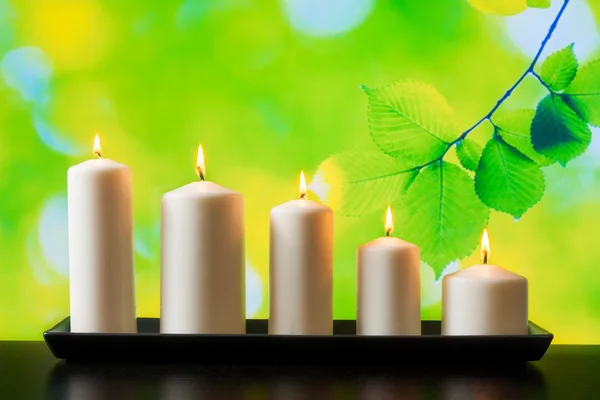 White candles on wood table — Stock Photo, Image