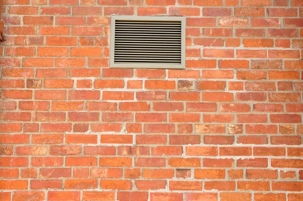 Bakstenen muur met ventilator — Stockfoto