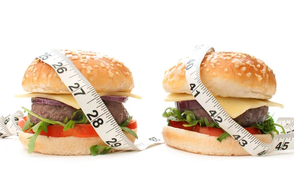 Burgers with tape measure — Stock Photo, Image