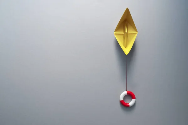 Buoy Attached Paper Boat Symbolising Business Recovery Insurance Rescue — Stock Photo, Image