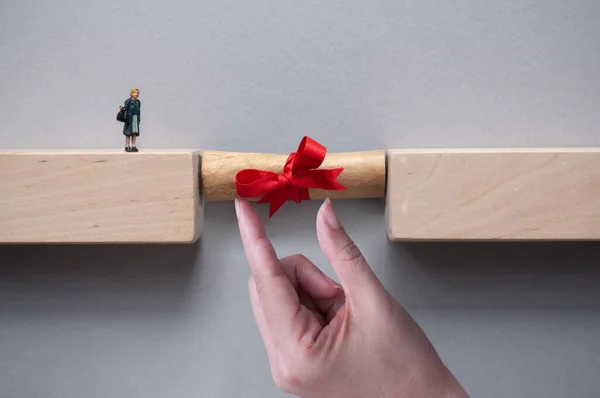 Graduation Scroll Bridging Gap Wooden Blocks Female Miniature Figure Cross — Fotografia de Stock