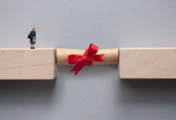 Graduation Scroll Bridging Gap Wooden Blocks Female Miniature Figure Cross — Fotografia de Stock