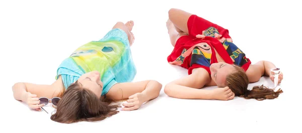 Two young girls lying and tan — Stock Photo, Image