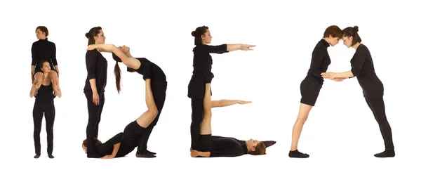 Black dressed people forming IDEA word over white — Stock Photo, Image