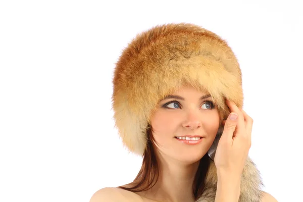 Close up portrait of young beautiful girl in fur hat over white background — Stock Photo, Image