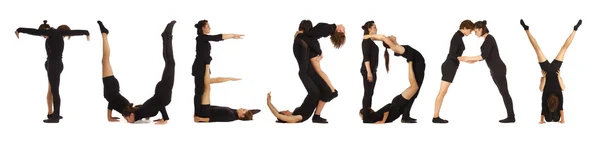 Gente vestida de negro formando palabra MARTES sobre blanco — Foto de Stock