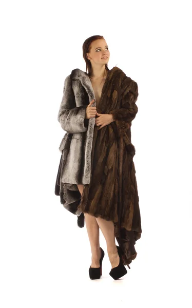 Young beautiful woman in a fur coat — Stock Photo, Image