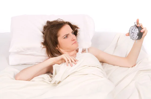 Woman waking up and looking on alarm clock in bed. view from above — Stock Photo, Image